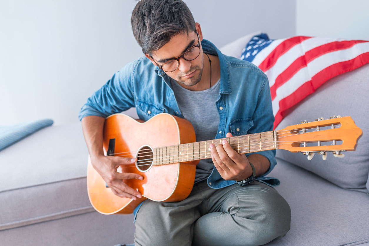 photo of a US musician playing guitar